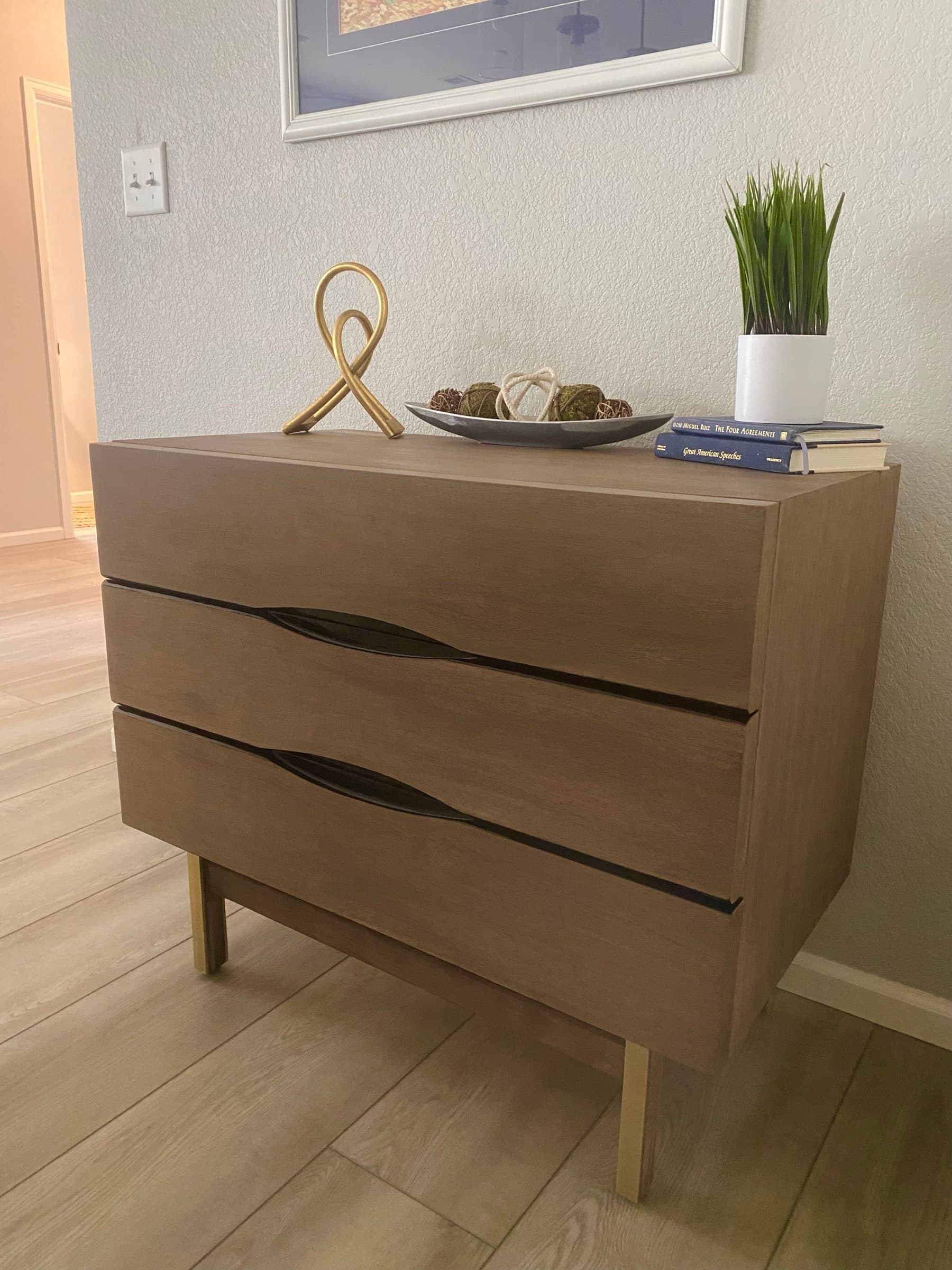 Real walnut dresser styled after restoration.